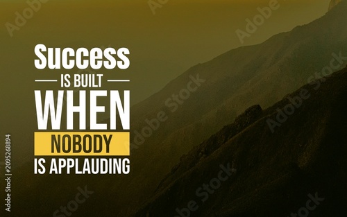 Motivational quote about building success through unseen effort, presented in bold typography on a dramatic golden mountain background.