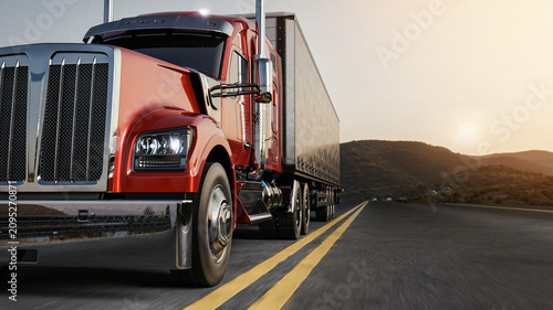 Obraz na plátně Red semi truck driving on highway at beautiful sunset