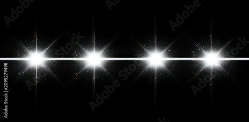 row of four intense starburst lights with horizontal flare and scattered sparkles on black background, dramatic futuristic luminous effect