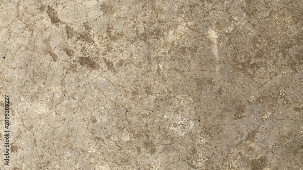 Obraz premium Dry cracked earth texture with beige soil pattern