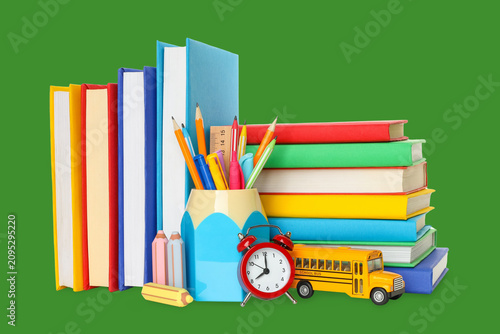 School supplies are neatly arranged alongside colorful books