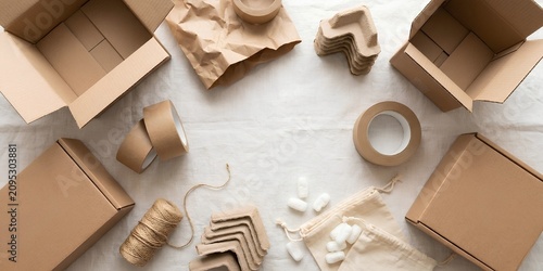 Sustainable Eco Friendly Packaging Materials and Cardboard Boxes on Neutral Background