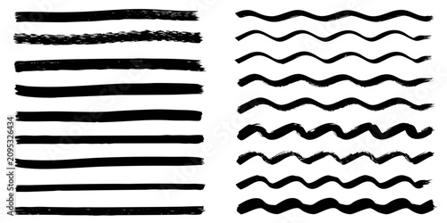 Fotografía thick black ink brush strokes and calligraphy swirls on white background vector