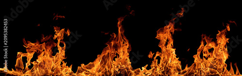 Photos blazing fire flames isolated on black background with intense heat, burning energy and dramatic texture, perfect for overlay, visual effects, safety, emergency, design and advertising