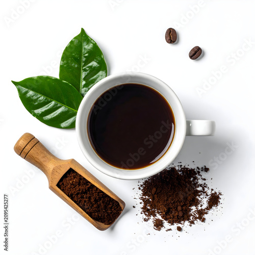 white cup of coffee with coffee seeds and leaf on white background