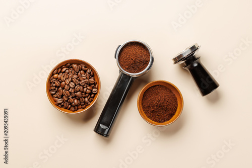 Canvas Print Espresso coffee setup with beans tamper and portafilter top view