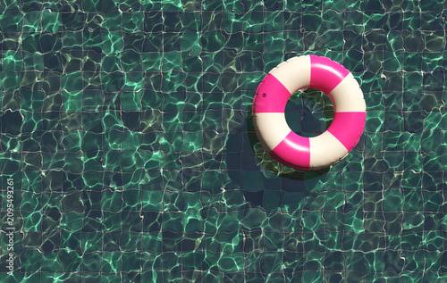 Beautiful swimming pool with pink swimming ring. Pool party, summer background. Top view. 