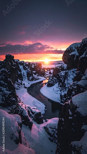 Snowy mountain landscape at sunset.