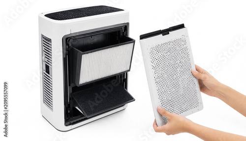 Person holding air purifier filter out of unit for cleaning transparent background