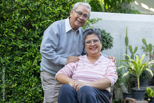 Cuadro en lienzo Happy smiling senior asian couple portrait standing together outdoor green garde