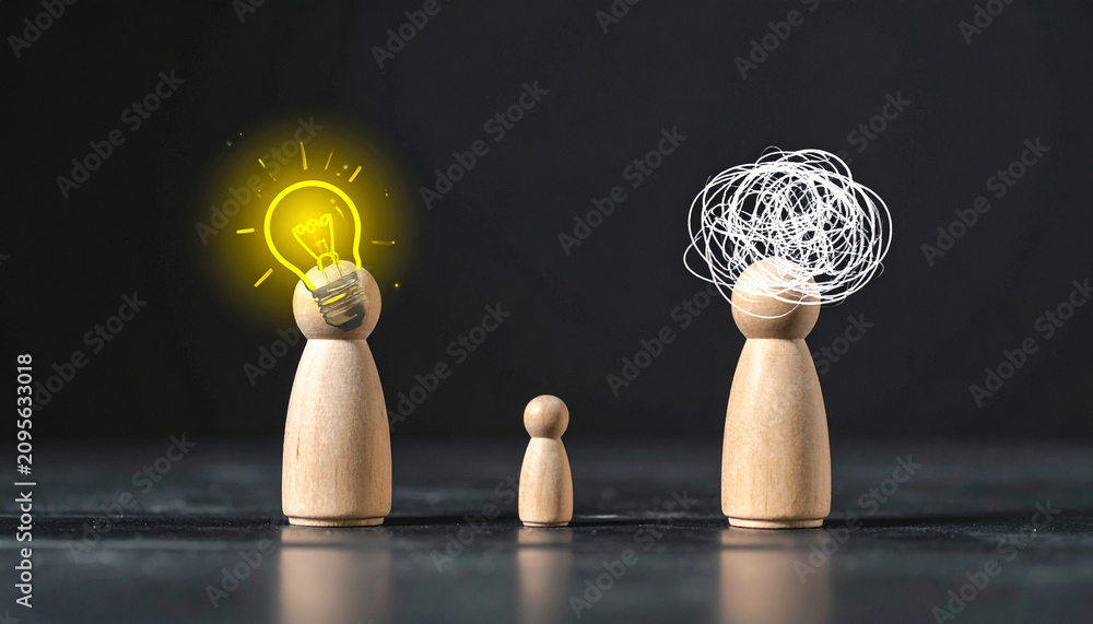 Fototapeta premium Wooden Figurines with Light Bulb and Question Marks