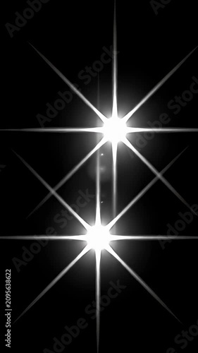 Triple white starburst flares on black backdrop.