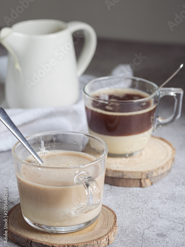 Layered coffee with sweetened condensed milk in glass