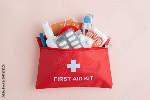 Canvas Print Red first aid kit bag with medical supplies