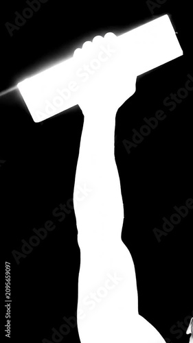 High contrast silhouette of a hand holding a megaphone.