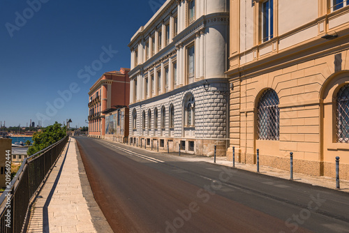 Charming historic streets and architecture of Taranto old town (Citta Vecchia) in Puglia, Italy. Featuring ancient stone buildings, narrow alleys, and rich heritage.