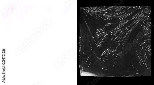 Tableau sur toile Crumpled plastic wrap texture on black background, transparent cling film overla