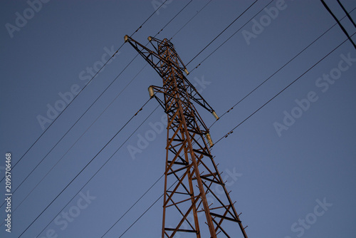 Принти на полотні Electricity pylon against blue sky at sunset