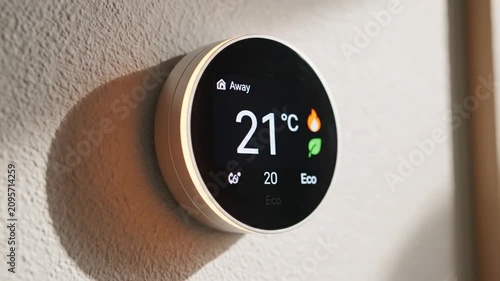 Round Wall Thermostat Displaying Cool Temperature in Minimal Home Interior