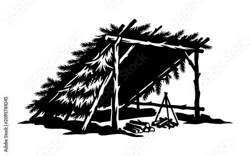 Photos Silhouette of a primitive bushcraft lean-to shelter with a campfire