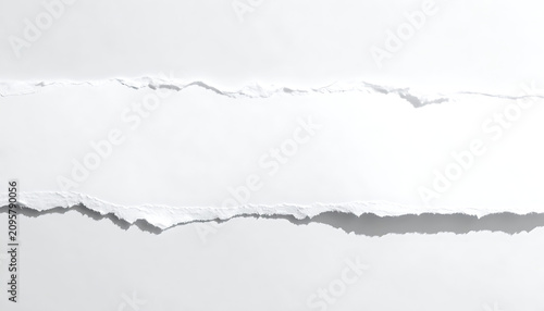 Closeup Of Torn White Paper Strips With Rough Edges On Blank Background