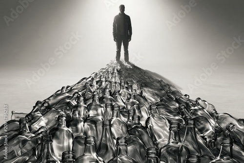Silhouette of a man standing on a path made of empty glass bottles, symbolizing addiction and recovery.