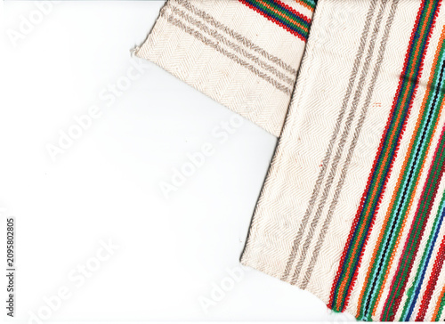 Photos Light background with antique hand-woven linen fabric with embroidery, two folde