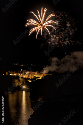Fireworks exploding over Bonifacio harbor in Corsica