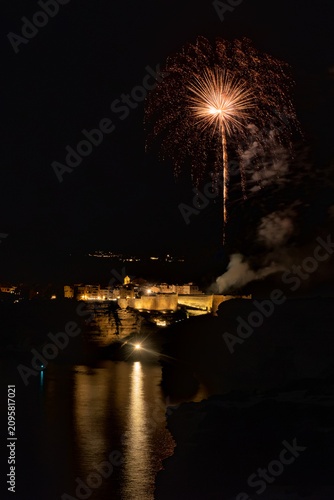 Fireworks exploding over Bonifacio town at night Corsica