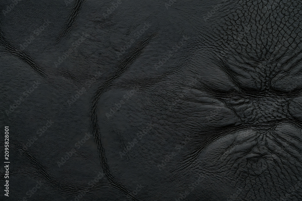 Obraz premium Black leather texture, quilted pattern embossed stitched