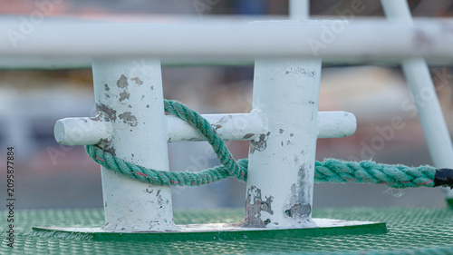 Canvastavla Boat Cleat with Green Mooring Rope Tied Around It