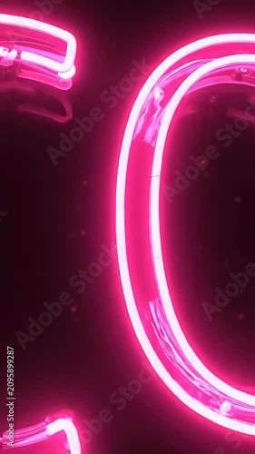 Glowing pink neon CO2 sign on black background.