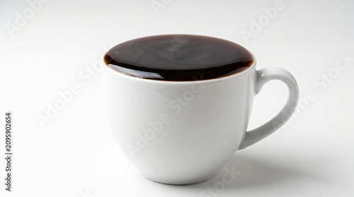 White Cup Filled With Black Coffee Right to the Very Brim Showing At Capacity and Overload