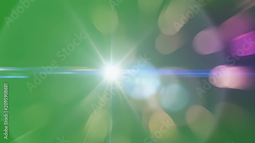 A blurred image showcases a vibrant green background with soft, out-of-focus bokeh lights scattered across the frame, creating an abstract and dreamy aesthetic.