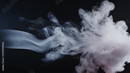 A captivating abstract image showcases swirling white smoke or ink against a stark black background, creating a dynamic and ethereal visual effect.