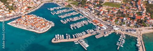 Bild auf Leinwand Aerial panorama of Tribunj marina and historic peninsula on the Adriatic coast,
