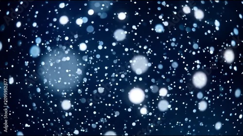 Abstract falling snow bokeh particles on dark blue background