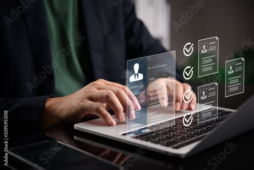 businessman hands typing laptop computer evaluating digital resume profile hologram virtual screen hr recruitment software talent acquisition candidate job application human resources interface