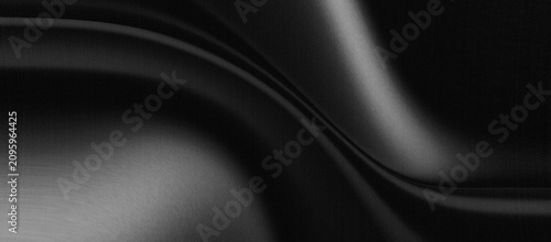 Fotografía black abstract background satin or silk fabric surface has a smooth texture and