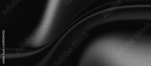 Photos black abstract background satin or silk fabric surface has a smooth texture and