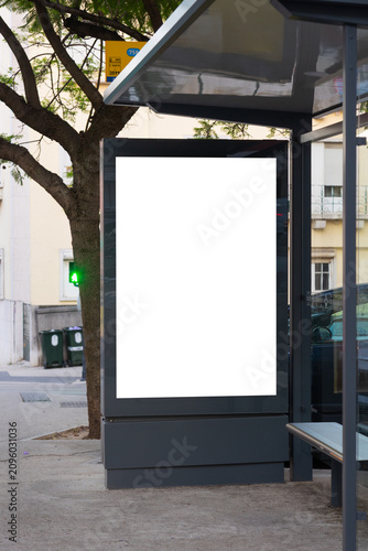 Canvas Print Blank advertising billboard integrated into a modern bus stop shelter in an urban environment
