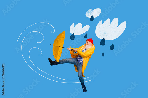 Cuadro en lienzo Elderly man in yellow raincoat fights wind with umbrella under cartoon clouds an