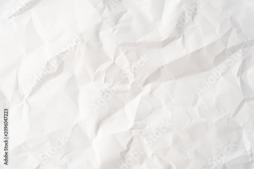 Grunge wrinkled white color paper textured background with copy space. Use for decoration or layer