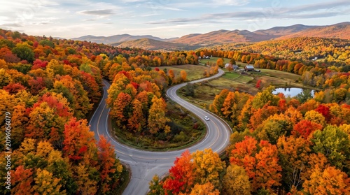 Winding asphalt road through autumn foliage and rolling hills scenic landscape photography fall autumnal highway