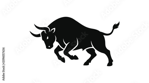Bild auf Leinwand Silhouette of a bull in a dynamic charging pose.