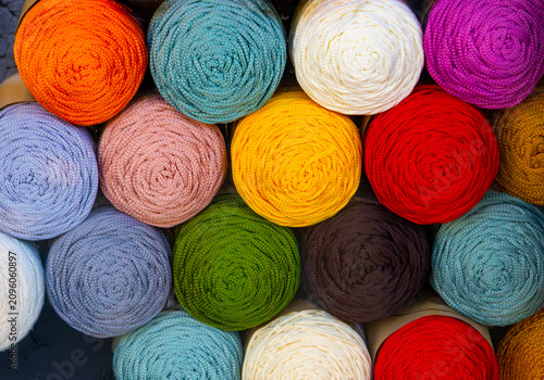 Colorful yarn stock for multiple crafting projects including crochet knitting and punch needle embroidery