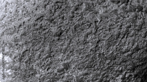 Foto Macro rough stone texture with coarse porous surface in monochrome tones, black and white abstract natural background for architectural and industrial visual designs