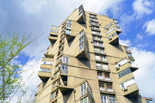 Obraz na plátně Low-angle view of Toblerone apartment tower in Belgrade with zigzag concrete balconies