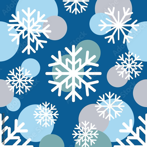 Foto White snowflakes on blue background with circles