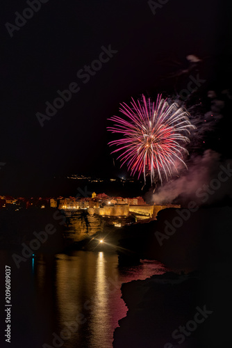Bonifacio town cliffs celebrating during night fireworks event